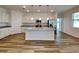 Kitchen island with granite counters, stainless steel appliances, and stylish pendant lighting at 298 Overbrook St, Port Charlotte, FL 33954