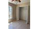 Bedroom with a window and closet offering ample storage space at 3358 Escobar Ln, North Port, FL 34286