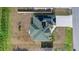 A bird's eye view of the home with solar panels, landscaped yard, and neat driveway at 3544 Monfero Ave, North Port, FL 34286