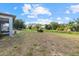 A large backyard showcasing ample space and lush greenery, perfect for outdoor activities at 3544 Monfero Ave, North Port, FL 34286
