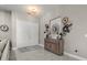 A welcoming entryway featuring a console table with decorative accents and a double-door entrance at 3544 Monfero Ave, North Port, FL 34286