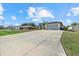 Charming home features a spacious two-car garage with a long driveway at 3544 Monfero Ave, North Port, FL 34286