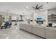 Open concept living room and kitchen with modern finishes and stainless appliances at 3544 Monfero Ave, North Port, FL 34286