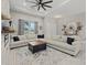 Open concept living room with large sectional sofa, rug, and modern decor at 3544 Monfero Ave, North Port, FL 34286