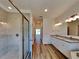 Bathroom showcasing a walk-in shower, double sinks and modern finishes at 384 Prineville St, Port Charlotte, FL 33954