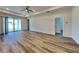 Spacious living room with hardwood floors and sliding glass doors at 384 Prineville St, Port Charlotte, FL 33954