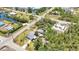 An aerial view of a single Gathering home surrounded by lush landscaping and a nearby waterway in a quiet neighborhood at 3927 Vasco St, Punta Gorda, FL 33950