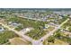 Expansive aerial view of the neighborhood with lush greenery and homes near a road intersection at 3927 Vasco St, Punta Gorda, FL 33950