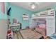 Comfortable bedroom with colorful decor, loft bed and desk area at 3927 Vasco St, Punta Gorda, FL 33950