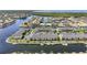 Aerial view of a waterfront community with condos, boat docks, canals, and lush landscaping at 4000 E Bal Harbor Blvd. E. #211 # 211, Punta Gorda, FL 33950