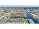 Wide aerial of waterfront homes, canals, and community parking with buildings nestled in a tropical setting at 4000 E Bal Harbor Blvd. E. #211 # 211, Punta Gorda, FL 33950