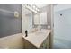 Bathroom featuring a vanity, modern lighting fixtures, and beadboard accents at 4000 E Bal Harbor Blvd. E. #211 # 211, Punta Gorda, FL 33950