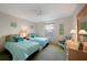 Bright bedroom featuring twin beds with ocean-themed decor and a ceiling fan at 4000 E Bal Harbor Blvd. E. #211 # 211, Punta Gorda, FL 33950