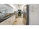 Well-lit white kitchen features stainless steel appliances and ample cabinet space at 4000 E Bal Harbor Blvd. E. #211 # 211, Punta Gorda, FL 33950