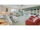 Airy living room with comfortable seating, a view to the outdoor patio, and lots of natural light at 4000 E Bal Harbor Blvd. E. #211 # 211, Punta Gorda, FL 33950