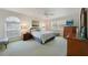 Comfortable bedroom with plush bedding, ample natural light, and classic wood furniture at 4000 E Bal Harbor Blvd. E. #211 # 211, Punta Gorda, FL 33950