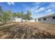 Large backyard featuring a storage shed and white fence at 4243 Hokan Ave, North Port, FL 34287