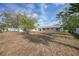 Large backyard with a storage shed and white fence at 4243 Hokan Ave, North Port, FL 34287