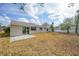 Large backyard featuring a patio and a white fence at 4243 Hokan Ave, North Port, FL 34287