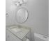 The bathroom has granite countertops, a round mirror, and is freshly painted at 4243 Hokan Ave, North Port, FL 34287