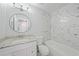 The bathroom features a bathtub with marble and granite countertops at 4243 Hokan Ave, North Port, FL 34287