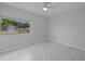 This bedroom features a ceiling fan and a large window at 4243 Hokan Ave, North Port, FL 34287