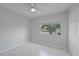 This bedroom has a ceiling fan, large window and a closet at 4243 Hokan Ave, North Port, FL 34287