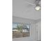 Bright bedroom featuring window, with a view of the backyard and ceiling fan at 4243 Hokan Ave, North Port, FL 34287