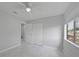 This bedroom features a ceiling fan and a large closet at 4243 Hokan Ave, North Port, FL 34287