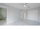 Bright bedroom featuring marble floors, a ceiling fan, closet, and bathroom with marble tile shower at 4243 Hokan Ave, North Port, FL 34287