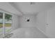 Bonus room featuring marble floors and sliding glass door to the backyard at 4243 Hokan Ave, North Port, FL 34287