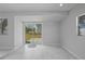 Bonus room featuring marble floors and sliding glass door to the backyard at 4243 Hokan Ave, North Port, FL 34287