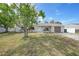 Exterior view of the home with a front yard and two-car garage at 4243 Hokan Ave, North Port, FL 34287