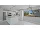 Modern kitchen boasting an island, stainless steel appliances, granite countertops, and pendant lighting at 4243 Hokan Ave, North Port, FL 34287
