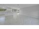 Spacious layout with contemporary flooring and a view of the bright, updated kitchen at 4243 Hokan Ave, North Port, FL 34287