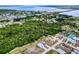 Aerial view showing a neighborhood with tree-lined streets and access to waterfront views at 4285 Oak Terrace Cir, Port Charlotte, FL 33953
