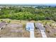 An aerial view of home nestled amongst natural landscaping and neighboring houses at 4285 Oak Terrace Cir, Port Charlotte, FL 33953