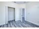 A bright bedroom featuring a closet, base trim, modern flooring, and ample electrical outlets at 4285 Oak Terrace Cir, Port Charlotte, FL 33953