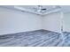 Spacious bedroom with ample natural light, ceiling fan, and modern flooring at 4285 Oak Terrace Cir, Port Charlotte, FL 33953