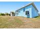 View of the home's exterior with lawn and landscaping at 4285 Oak Terrace Cir, Port Charlotte, FL 33953