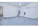 Spacious garage featuring epoxy flooring and water heater at 4285 Oak Terrace Cir, Port Charlotte, FL 33953