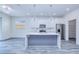 Contemporary kitchen featuring stainless steel appliances, quartz countertops, and a stylish island at 4285 Oak Terrace Cir, Port Charlotte, FL 33953