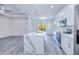 Elegant kitchen featuring an island with quartz countertops and stainless steel appliances at 4285 Oak Terrace Cir, Port Charlotte, FL 33953