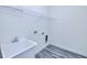 Practical laundry area with a utility sink, storage shelf, and hookups for appliances at 4285 Oak Terrace Cir, Port Charlotte, FL 33953