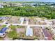 A high angle view of a well-planned neighborhood surrounded by lush vegetation and scattered homes at 4290 Oak Terrace Cir, Port Charlotte, FL 33953