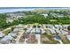 Aerial view of house, neighborhood, and water in the distance, showing community location at 4290 Oak Terrace Cir, Port Charlotte, FL 33953