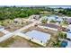 Expansive aerial view of a charming community with lush trees and manicured lawns near coastal waterways at 4290 Oak Terrace Cir, Port Charlotte, FL 33953