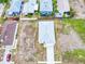 Aerial view of a house highlighting roof, driveway, and surrounding houses in neighborhood at 4290 Oak Terrace Cir, Port Charlotte, FL 33953