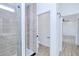 Walk-in shower with a glass door and tile surround next to a toilet room at 4290 Oak Terrace Cir, Port Charlotte, FL 33953