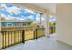 Covered porch featuring an iron fence and views of the backyard at 4290 Oak Terrace Cir, Port Charlotte, FL 33953